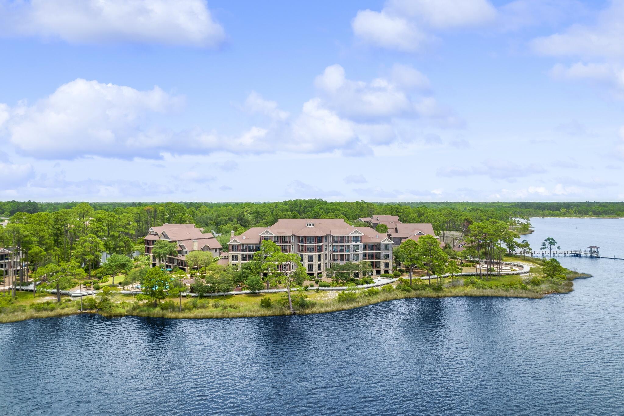 1102 Prospect Promenade, Unit 202 Panama City Beach, FL 32413 - Photo 2 of 35 a view of a city with lawn chairs