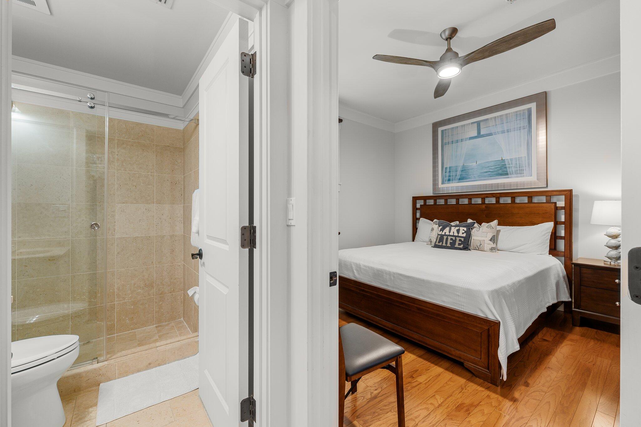 1102 Prospect Promenade, Unit 202 Panama City Beach, FL 32413 - Photo 25 of 35 a bedroom with a bed and a window