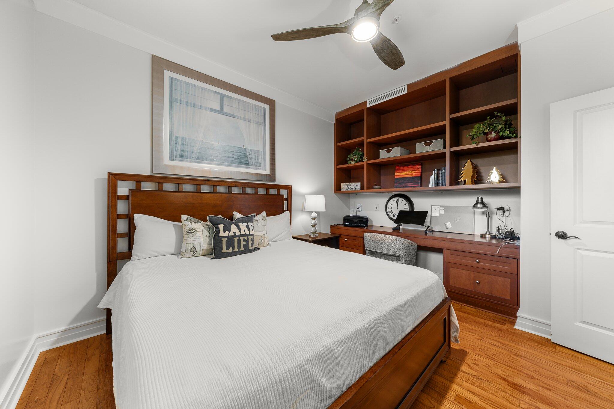 1102 Prospect Promenade, Unit 202 Panama City Beach, FL 32413 - Photo 26 of 35 a bedroom with a bed and closet