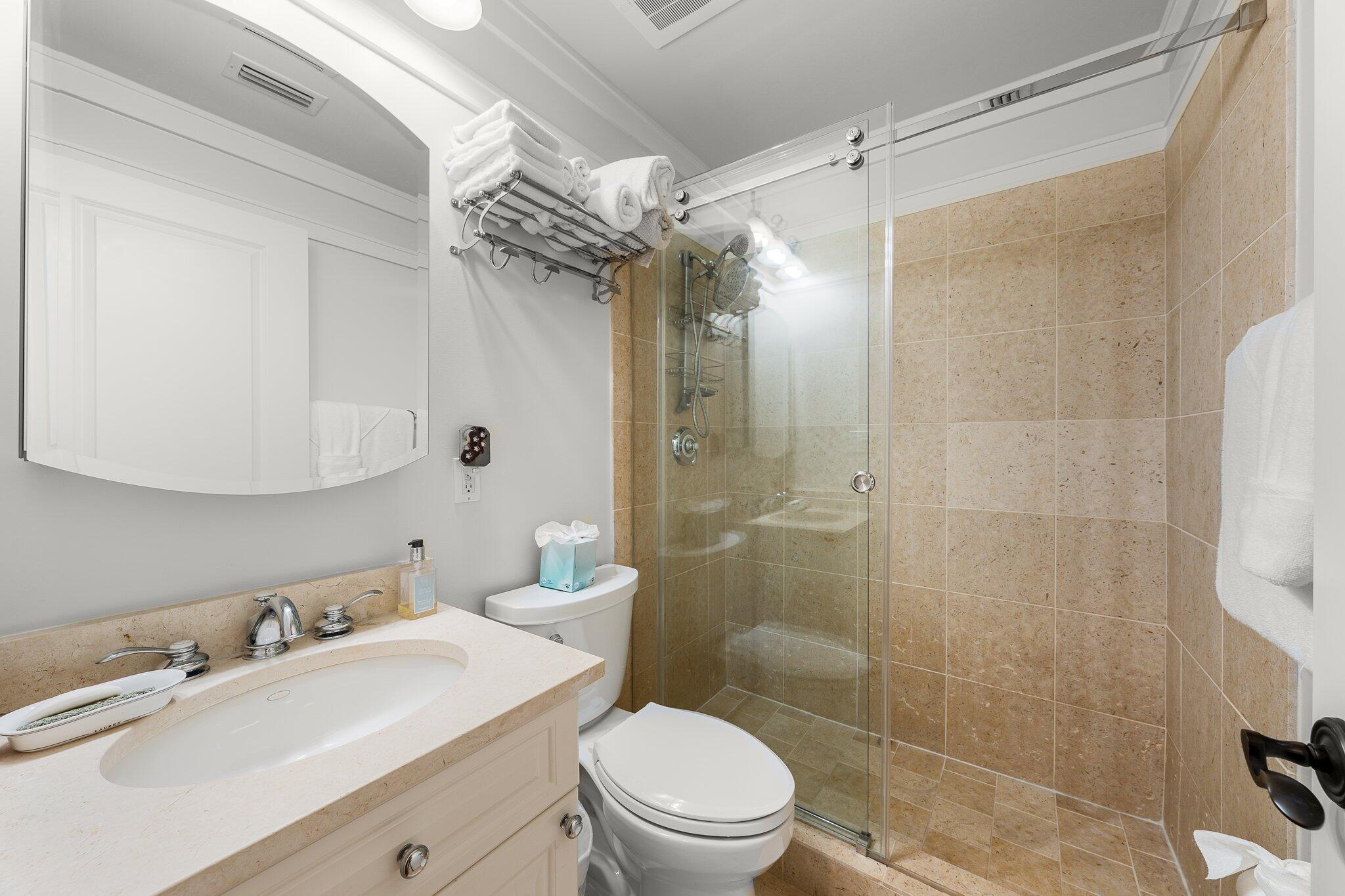 1102 Prospect Promenade, Unit 202 Panama City Beach, FL 32413 - Photo 28 of 35 a bathroom with a sink a toilet and shower