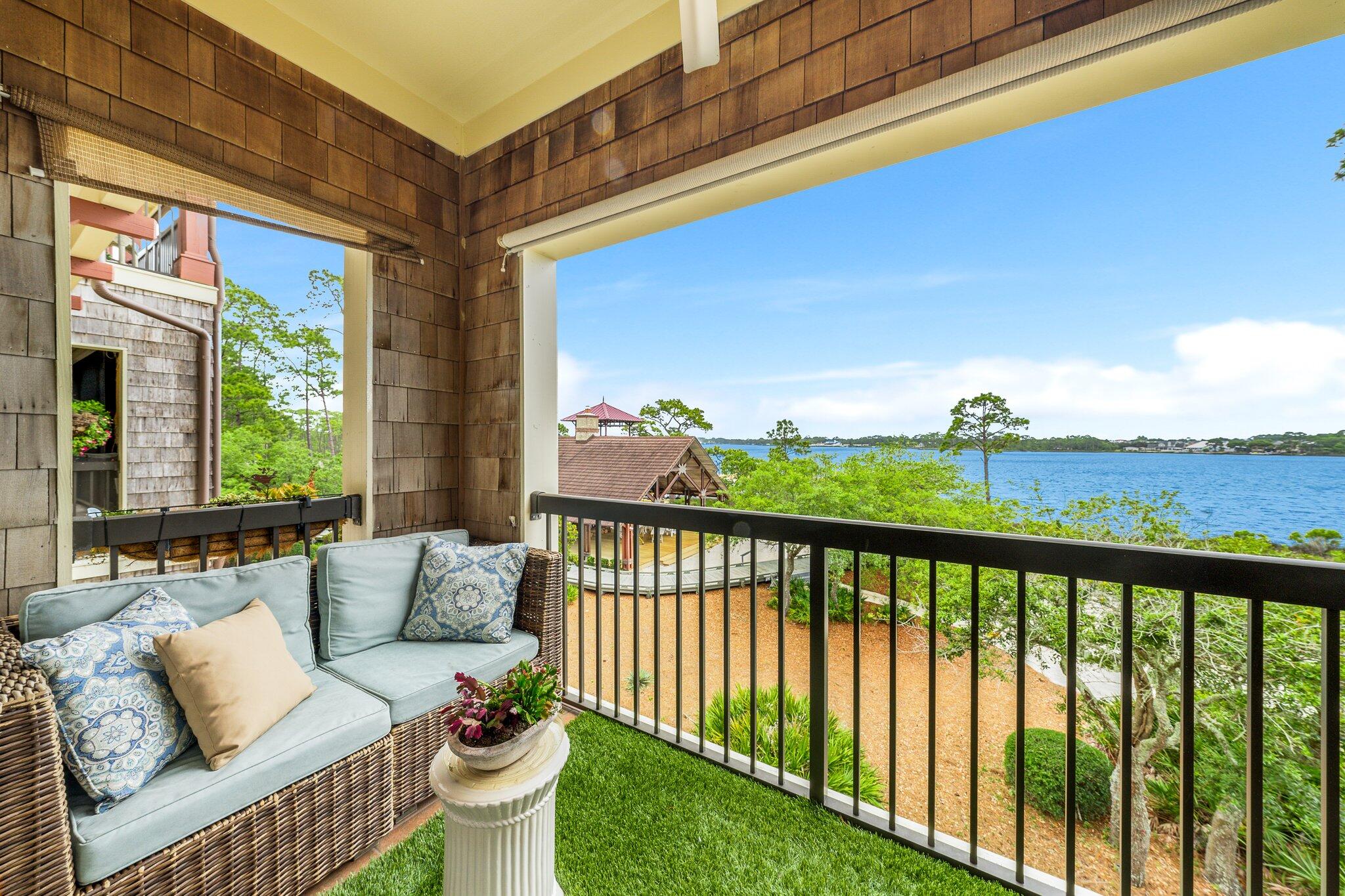 1102 Prospect Promenade, Unit 202 Panama City Beach, FL 32413 - Photo 31 of 35 a view of a chairs and table in the balcony