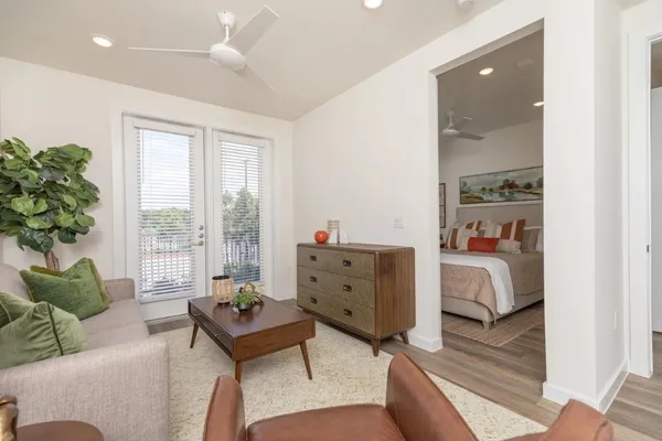a living room with furniture and a large window