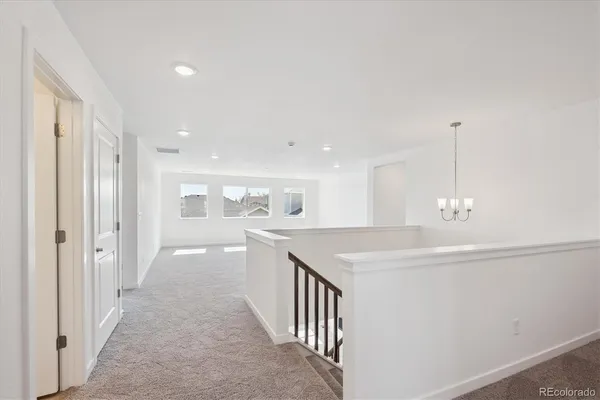 a view of a kitchen from the hallway