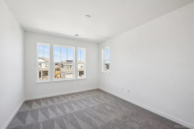 a view of a kitchen with wooden floor and window