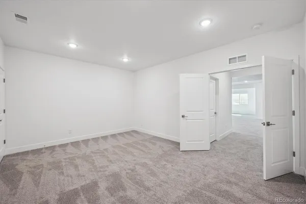 an empty room with a bathroom