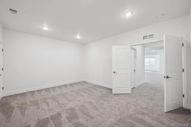 an empty room with a bathroom