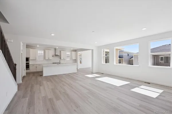 a view of kitchen with cabinets and wooden floor