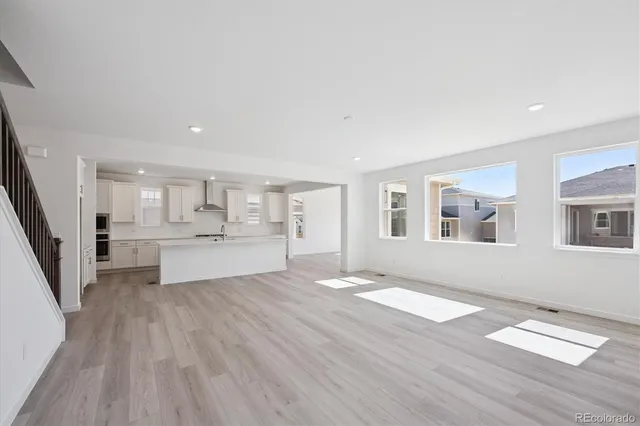 a view of kitchen with cabinets and wooden floor