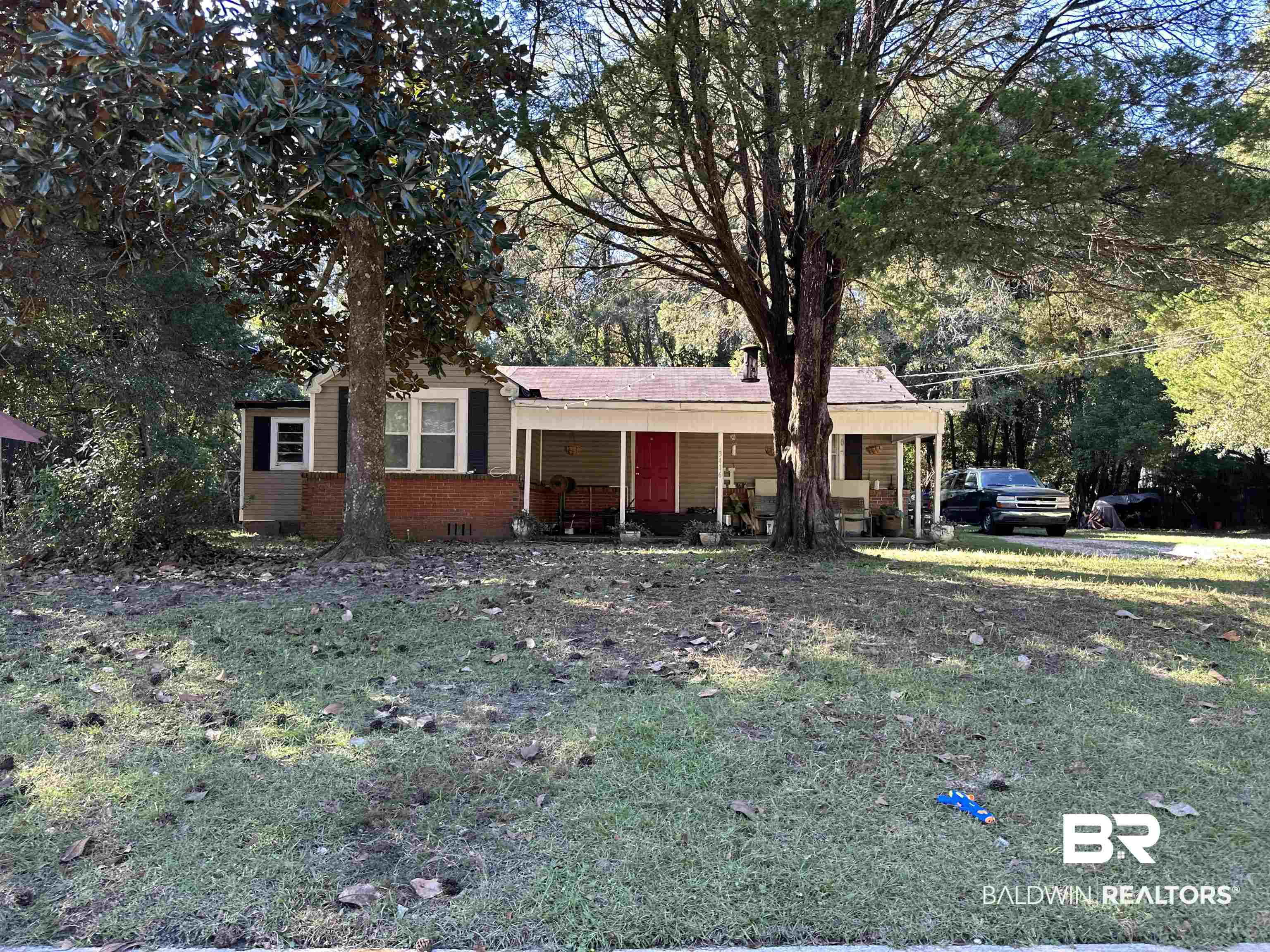 3416 Fairfield Road Mobile, AL 36605 - Photo 2 of 2 View of front of home featuring a porch and a front lawn