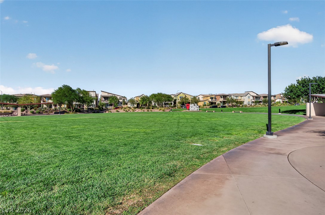 1100 East Sunset Road Henderson, NV 89011 - Photo 56 of 58 Green space beckons in this community park, offering a verdant oasis with residential backdrop.
