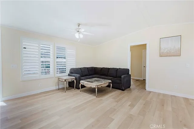 a kitchen with a refrigerator and a stove top oven