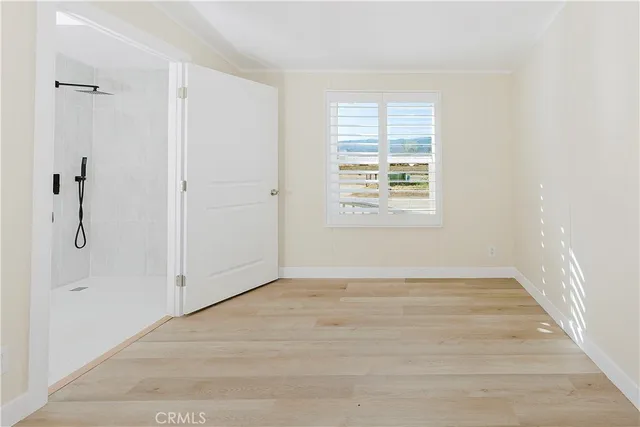 a view of an entryway with wooden floor