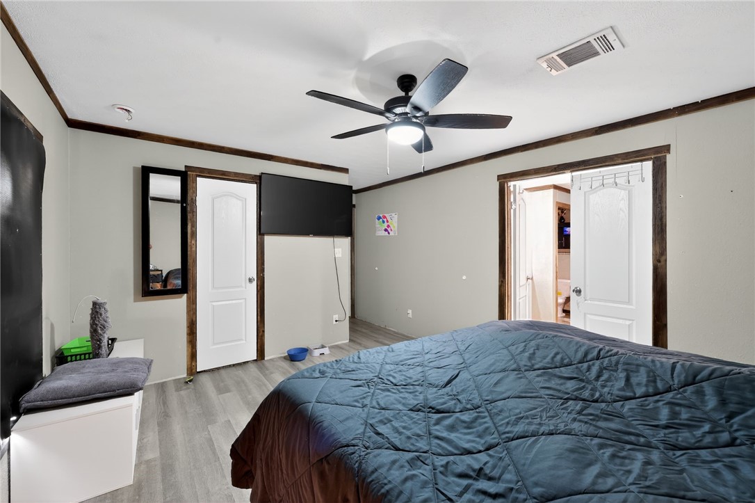 4046 Farm To Market 666 Robstown, TX 78380 - Photo 11 of 29 a bedroom with a bed and a couch