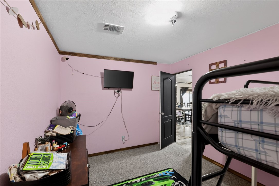 4046 Farm To Market 666 Robstown, TX 78380 - Photo 13 of 29 a bedroom with a bed and a window