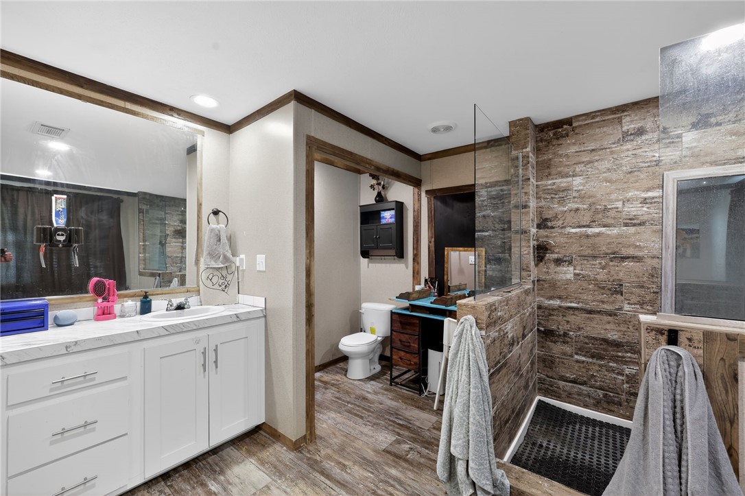 4046 Farm To Market 666 Robstown, TX 78380 - Photo 18 of 29 a en suite bathroom with a sink a mirror and shower