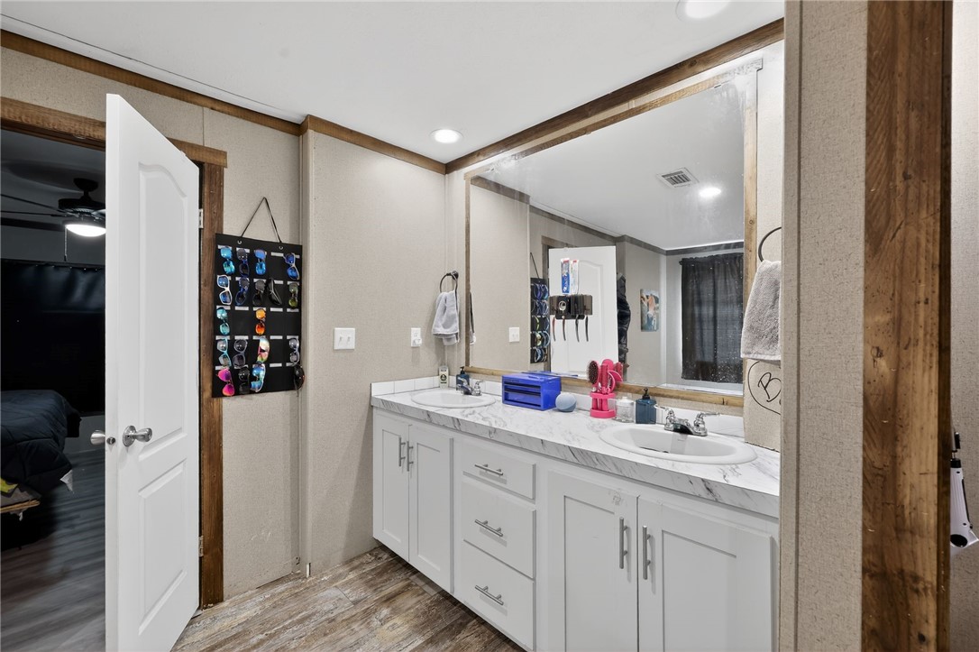 4046 Farm To Market 666 Robstown, TX 78380 - Photo 21 of 29 a bathroom with a double vanity sink mirror and double