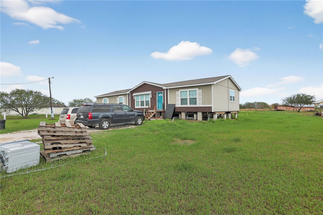 4046 Farm To Market 666 Robstown, TX 78380 - Photo 27 of 29 a view of a house with a backyard and sitting area