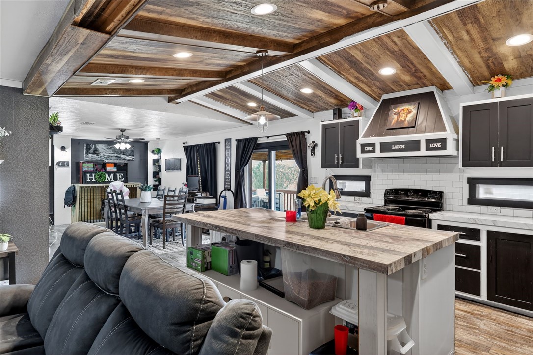 4046 Farm To Market 666 Robstown, TX 78380 - Photo 6 of 29 a kitchen with stainless steel appliances granite countertop a stove and cabinets