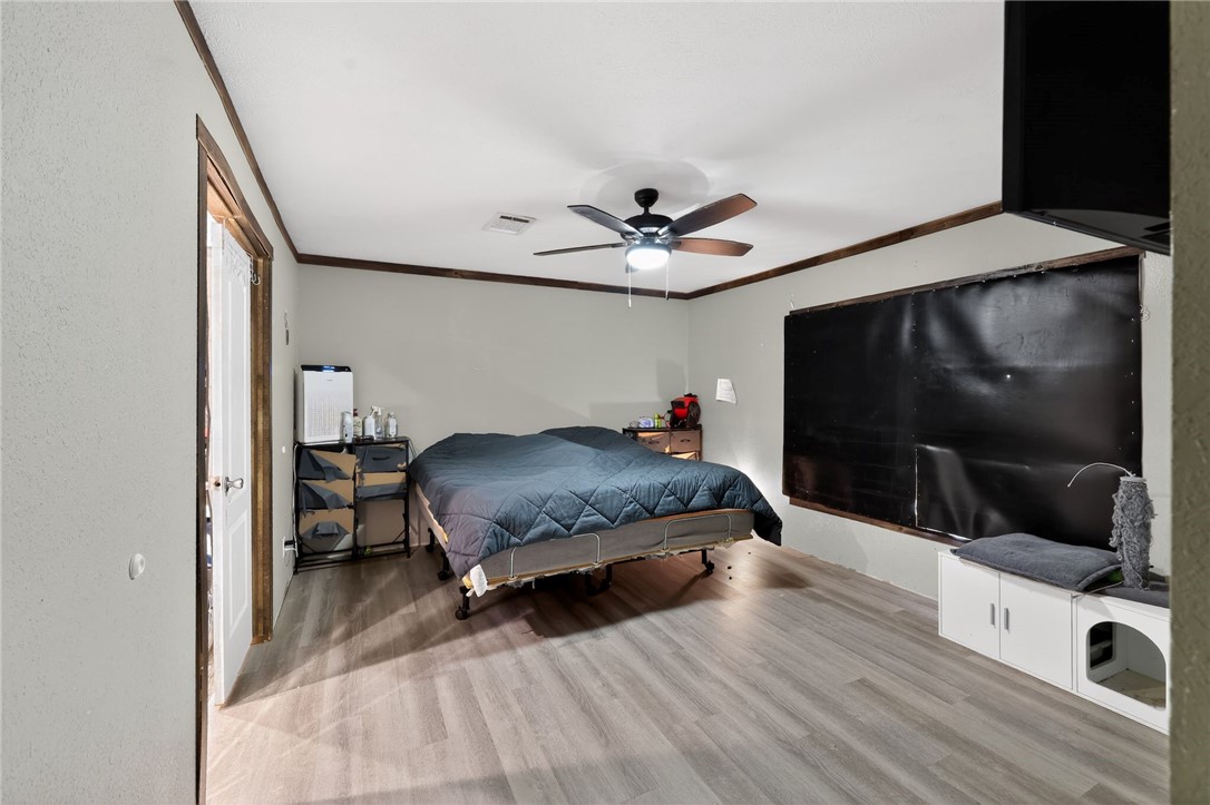 4046 Farm To Market 666 Robstown, TX 78380 - Photo 10 of 29 a bedroom with a bed and a flat screen tv