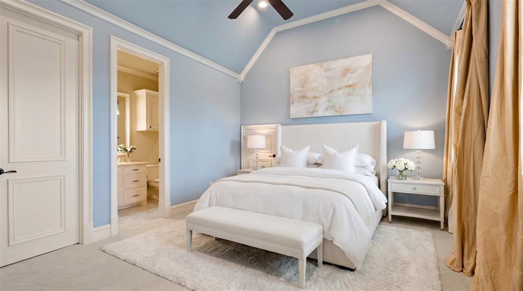 6900 Rockingham Court Colleyville, TX 76034 - Photo 21 of 40 Vaulted ceiling bedroom featuring a ceiling fan and light-toned wall finishes. Ai staged.
