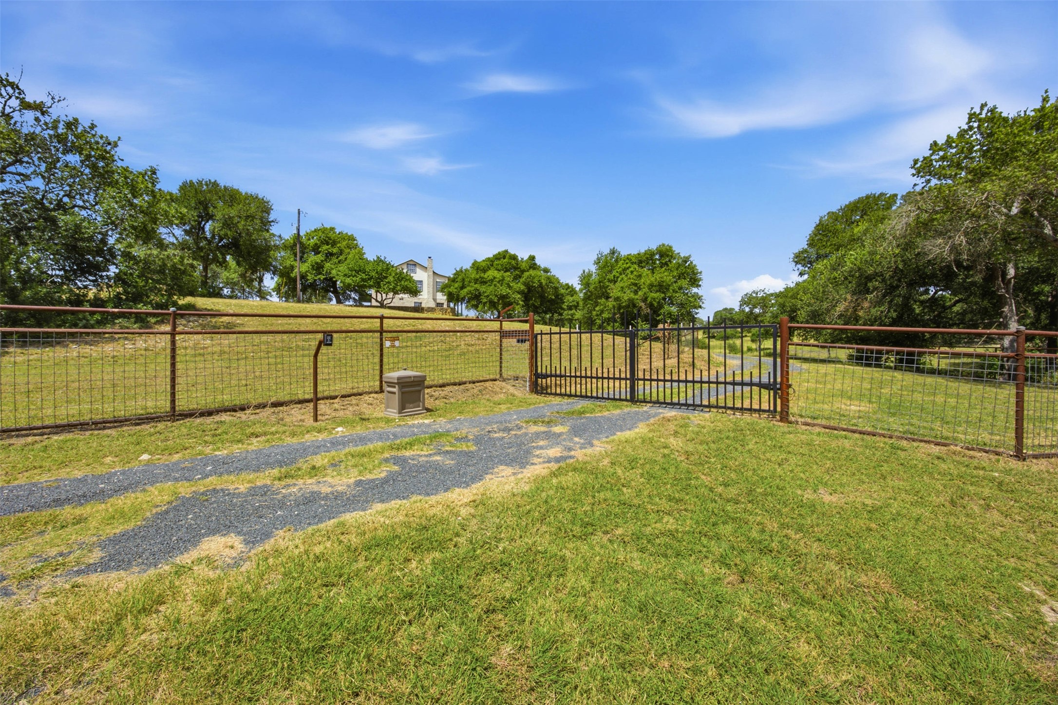 720 Spring Creek Road Florence, TX 76527 - Photo 36 of 40 Rear driveway and access gate off of Spring Creek RD.
