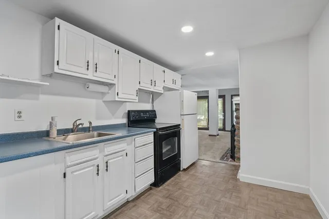 a kitchen with a sink and cabinets