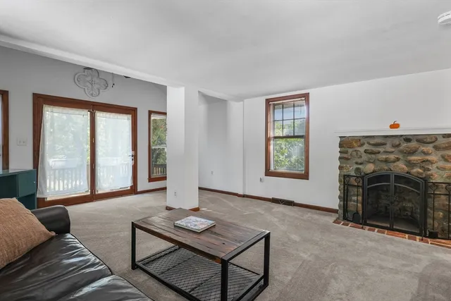 a living room with furniture and a window