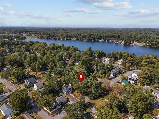 an aerial view of residential houses with city view