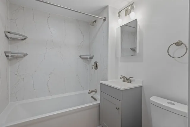 a kitchen with granite countertop a stove sink and cabinets