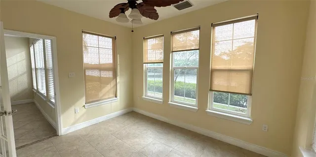 a view of an empty room with a window