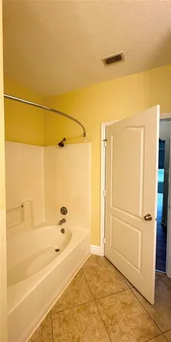 a kitchen with a sink and white cabinets