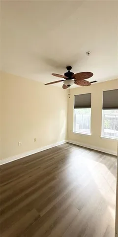 a view of a kitchen with a stove top oven a sink and a window