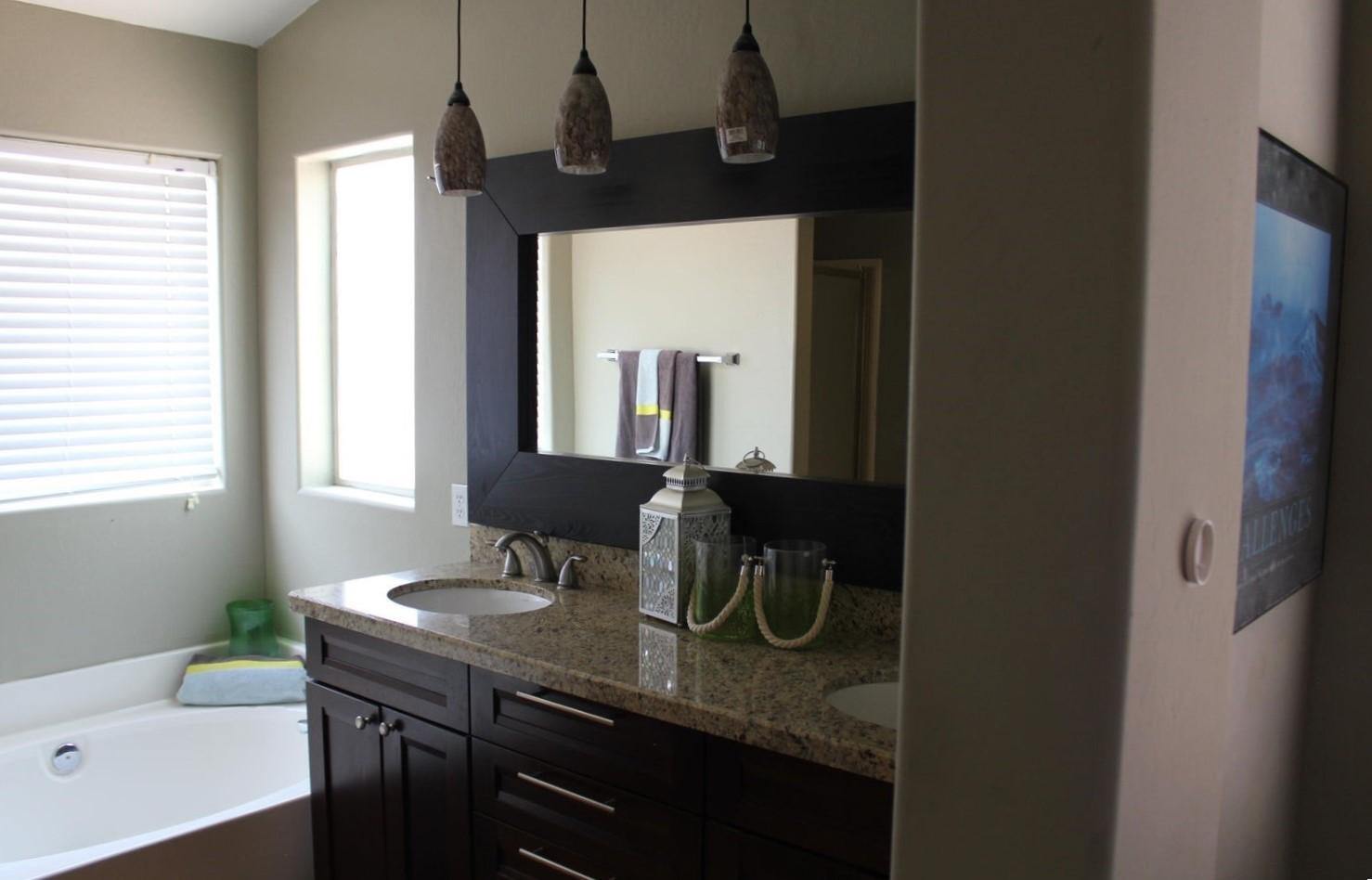 9456 East Pine Valley Road Scottsdale, AZ 85260 - Photo 15 of 18 a bathroom with a granite countertop sink and a mirror
