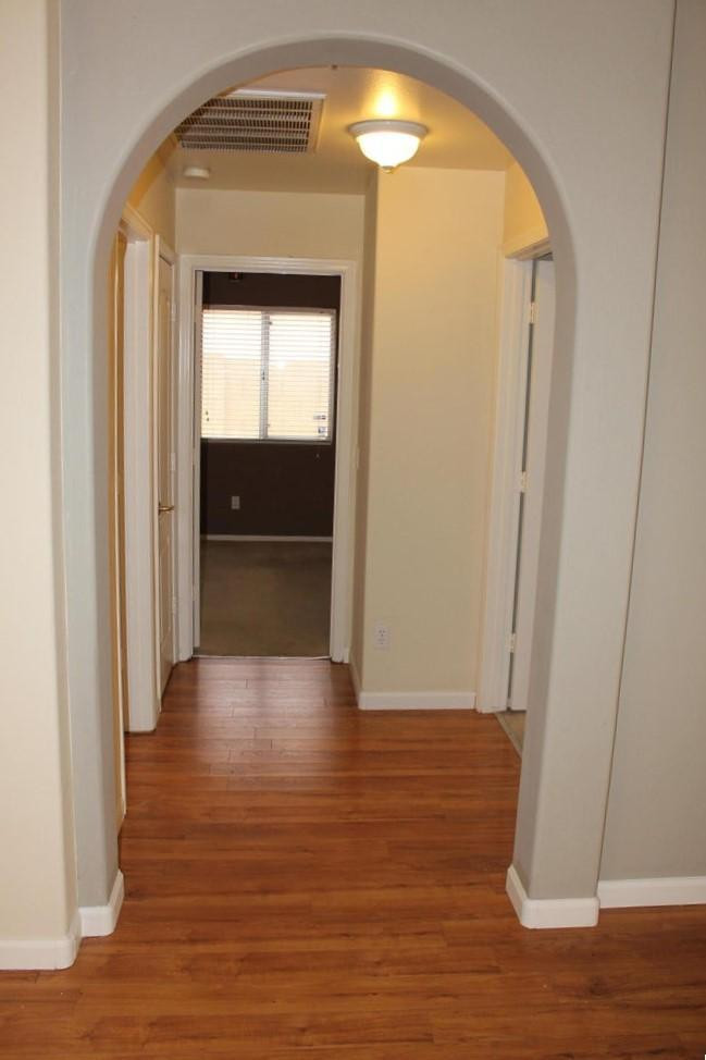 9456 East Pine Valley Road Scottsdale, AZ 85260 - Photo 18 of 18 a view of a hallway with wooden floor and closet