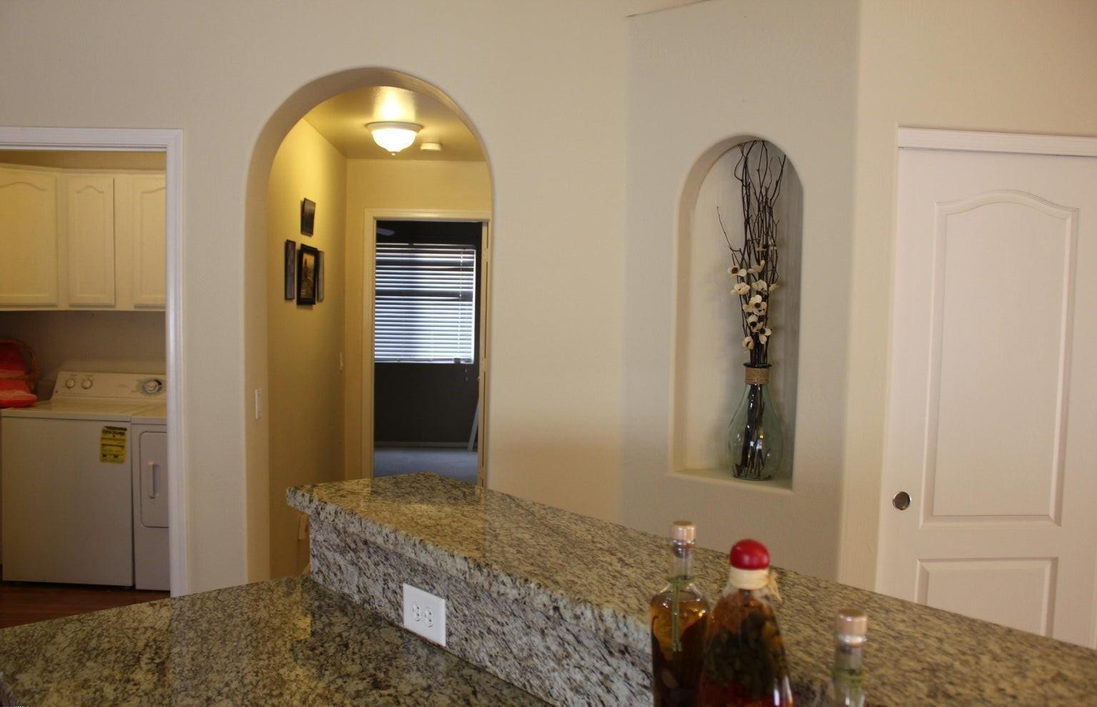 9456 East Pine Valley Road Scottsdale, AZ 85260 - Photo 3 of 18 a view of room with window and couch