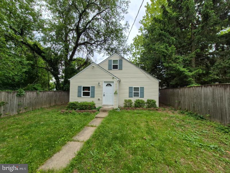 215 Sycamore Road Glen Burnie, MD 21060 - Photo 2 of 16 Charming home with lush greenery.