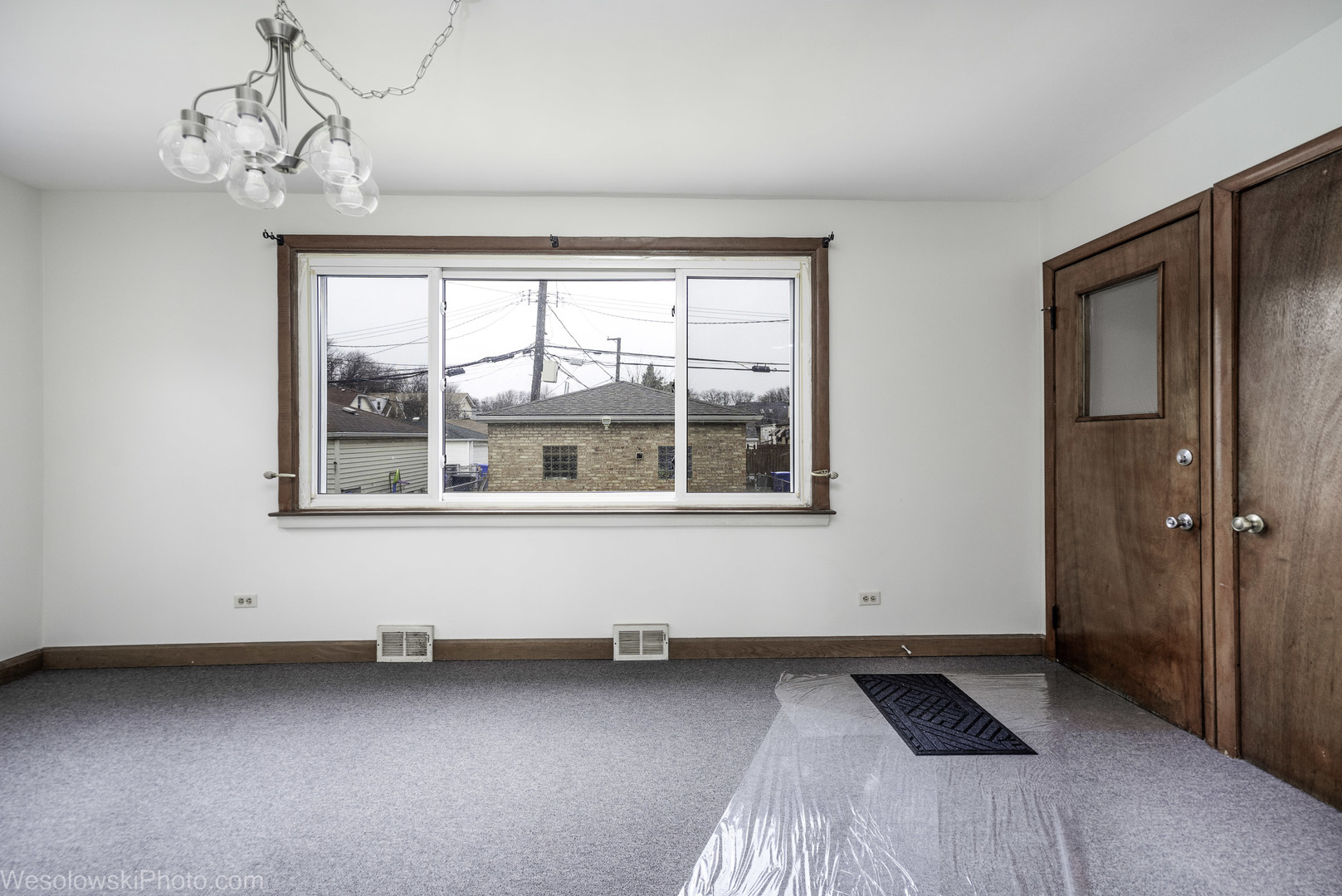 5944 West Foster Avenue Chicago, IL 60630 - Photo 10 of 21 a view of an empty room with a window