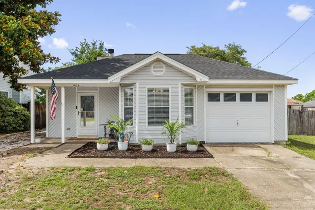 a front view of a house with garden