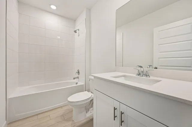 a bathroom with a sink a toilet and a bathtub