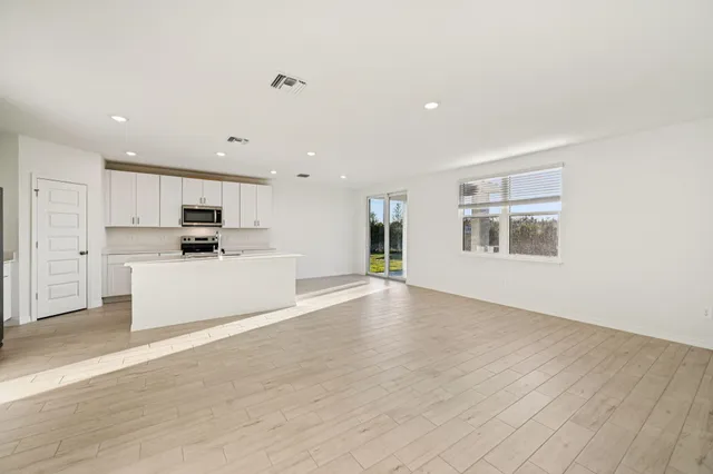 a view of a kitchen with a sink cabinets and a window