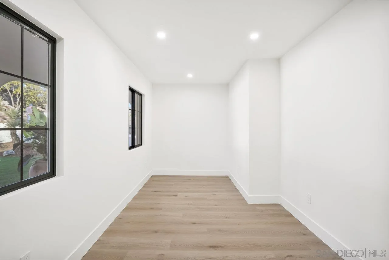 8843 Mariposa Street La Mesa, CA 91941 - Photo 25 of 60 a view of a hallway with wooden floor
