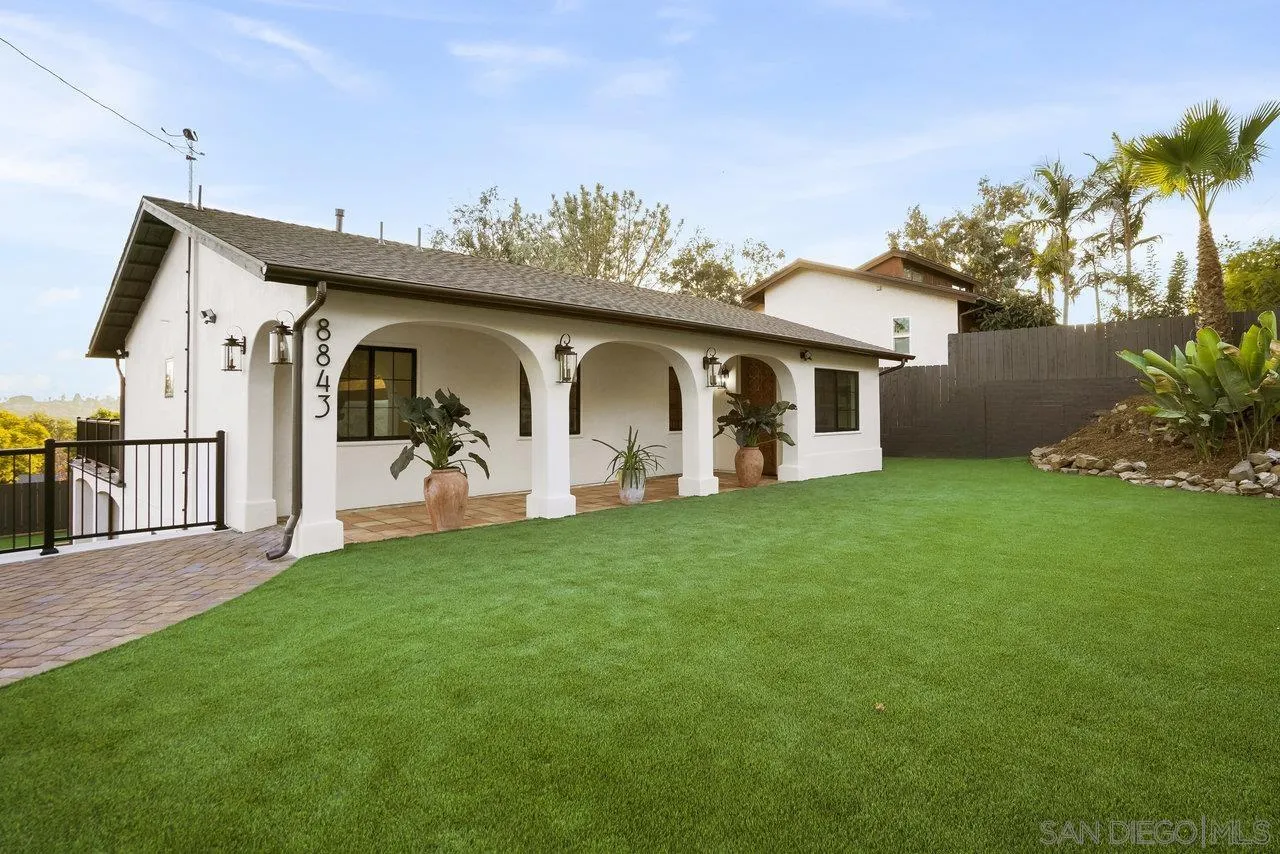 8843 Mariposa Street La Mesa, CA 91941 - Photo 3 of 60 a front view of a house with garden