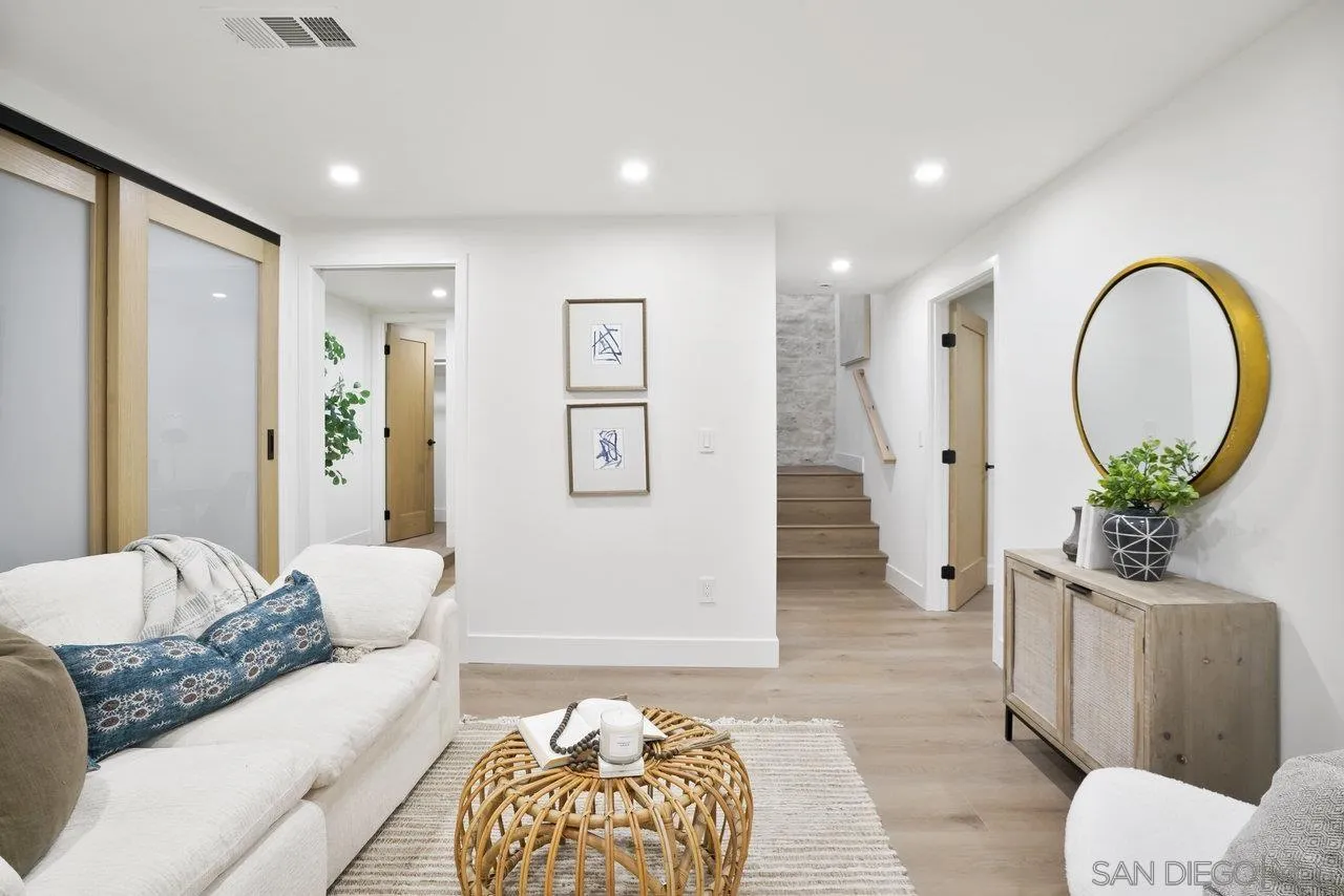 8843 Mariposa Street La Mesa, CA 91941 - Photo 40 of 60 a living room with furniture and a potted plant