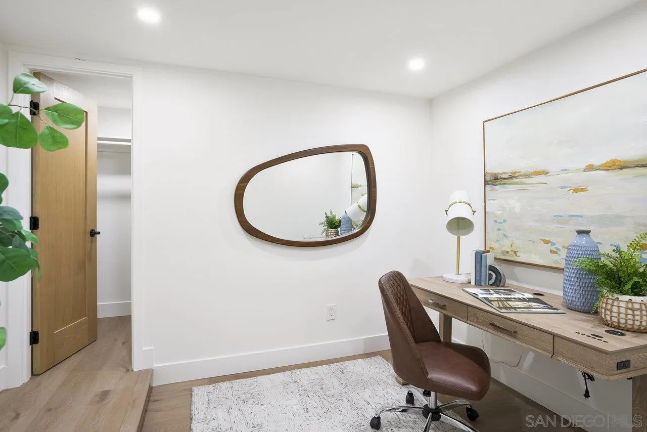 8843 Mariposa Street La Mesa, CA 91941 - Photo 41 of 60 a view of a workspace room with wooden floor and a mirror