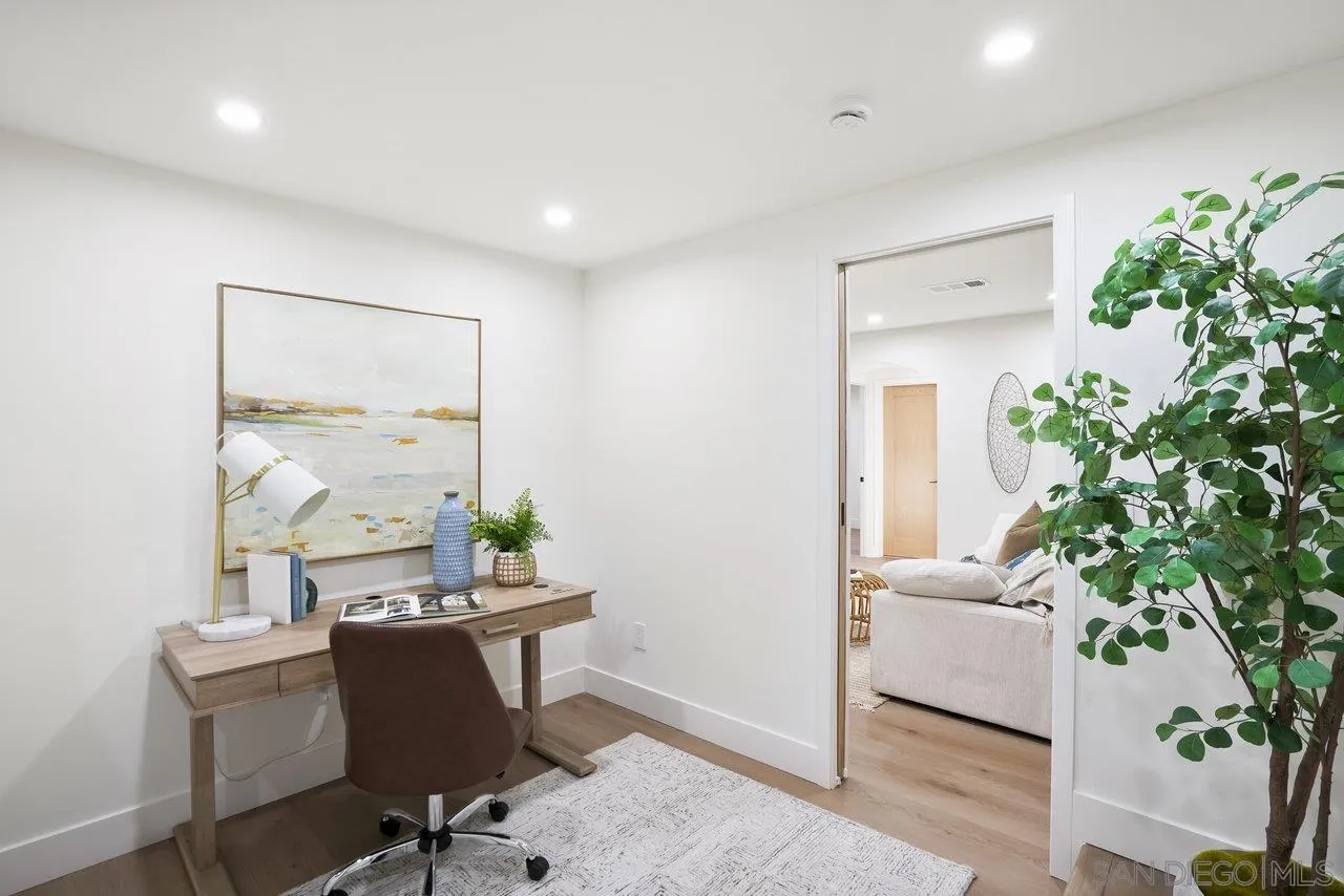 8843 Mariposa Street La Mesa, CA 91941 - Photo 42 of 60 a view of a workspace with furniture and a potted plant