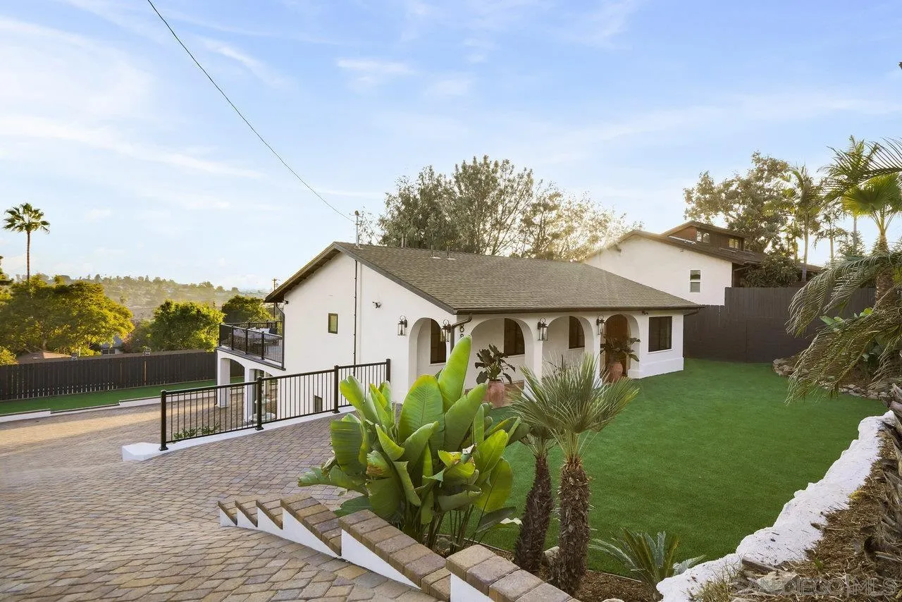 8843 Mariposa Street La Mesa, CA 91941 - Photo 52 of 60 a house with trees in the background