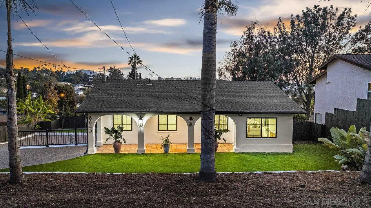 8843 Mariposa Street La Mesa, CA 91941 - Photo 54 of 60 a front view of a house with garden