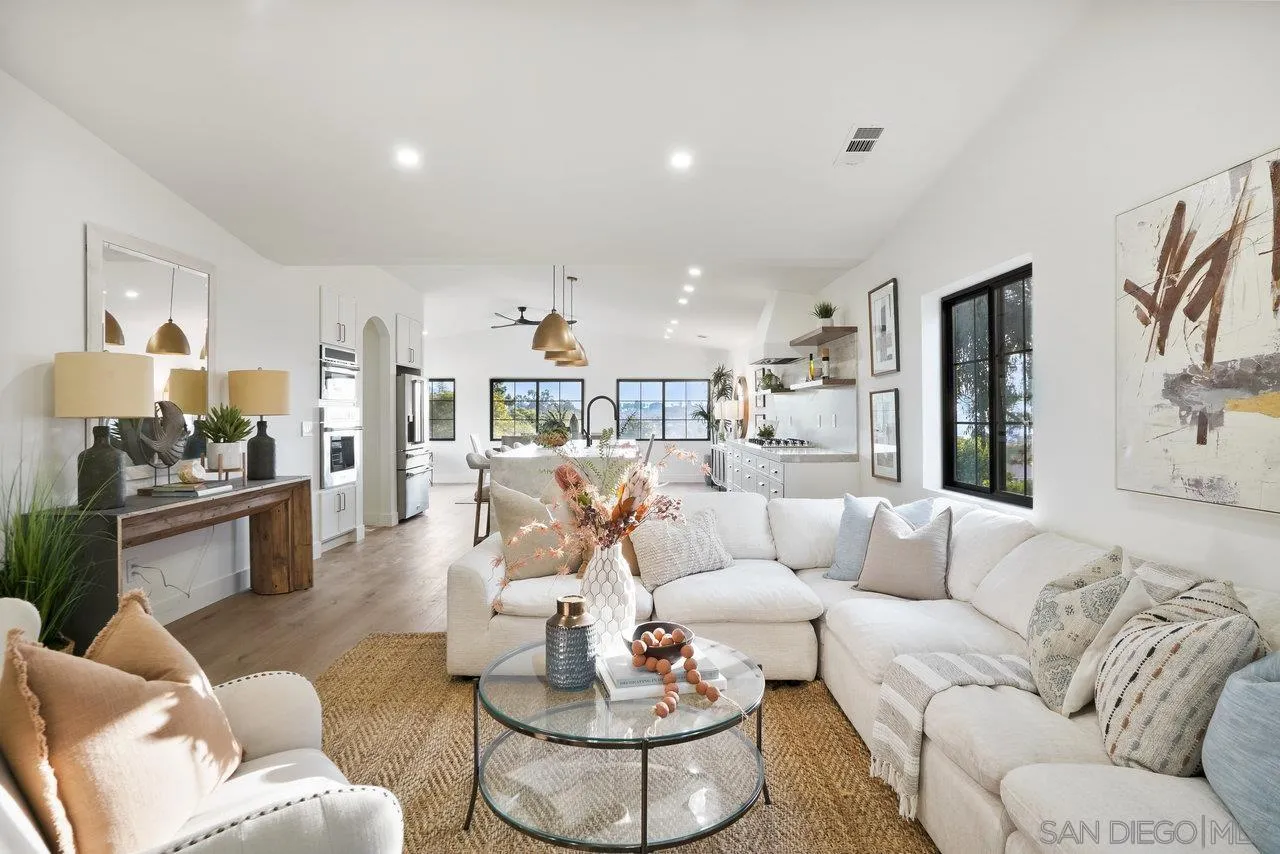 8843 Mariposa Street La Mesa, CA 91941 - Photo 9 of 60 a living room with furniture and a dining table with wooden floor