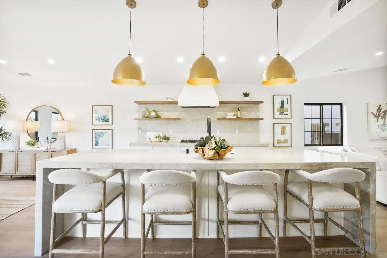 8843 Mariposa Street La Mesa, CA 91941 - Photo 10 of 60 a kitchen with stainless steel appliances granite countertop a table chairs and a kitchen view