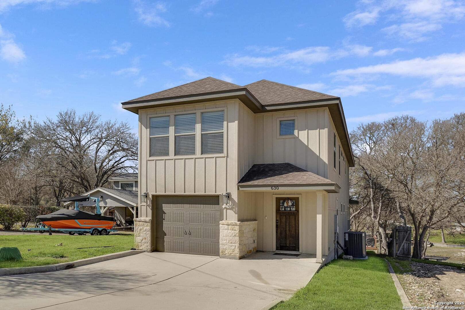 630 3 Oaks Road Seguin, TX 78155 - Photo 1 of 36 a front view of a house with a garden